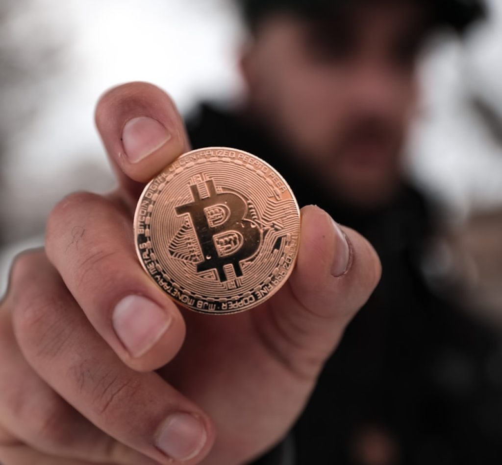 a person holding a coin